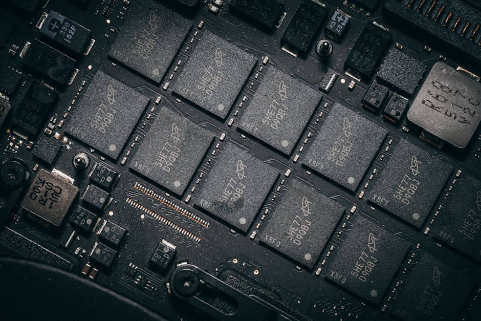 Detailed view of electronic circuit board components showcasing microchips and technology intricacies